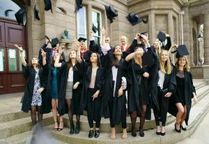 Institute of Law students throwing their mortabars in the air